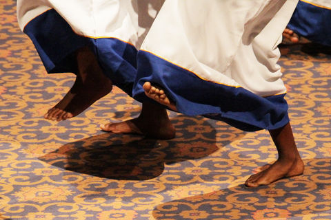 Barefoot dancers in traditional robe