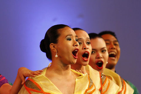 Choir performing on stage © MBC Manila