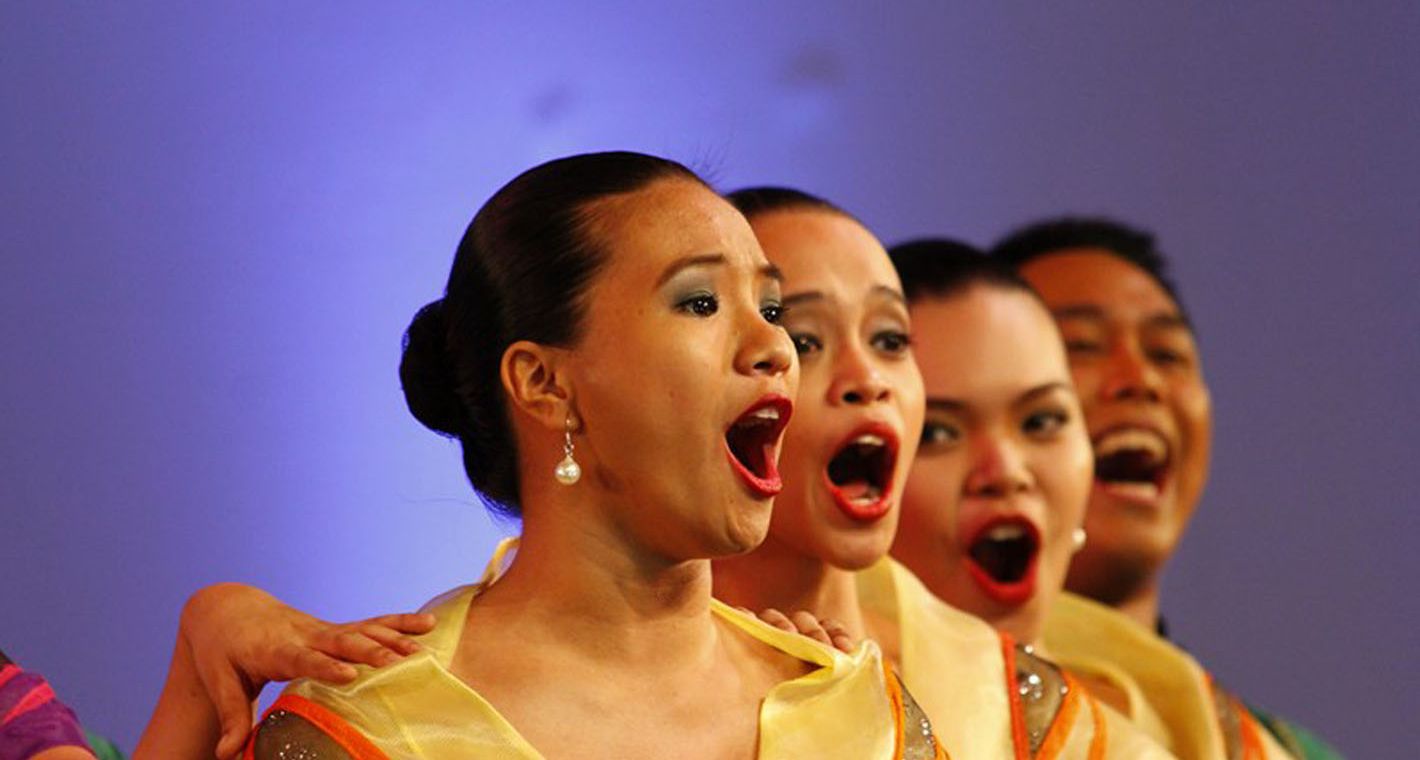 Choir performing on stage © MBC Manila