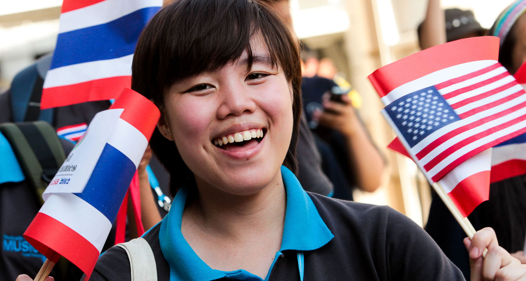 Singer from Thailand waving flags © Dan Ledbetter