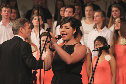 Soloist in front of a choir