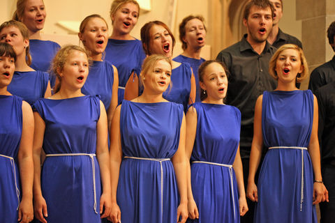 Singing choir in blue dresses